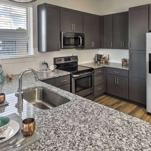 Spacious kitchens with thoughtful details a kitchen with marble counters