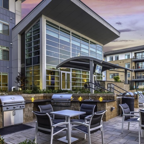Take advantage of all The Abbey has to offer a patio with chairs and tables outside a building