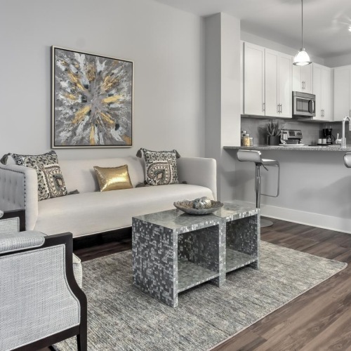 Spacious living areas to recline and recharge a living room with a couch and a table