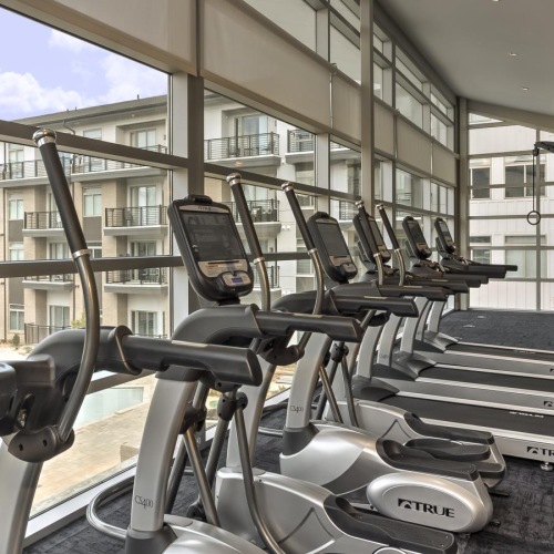 Cutting-edge amenities at your fingertips a gym with exercise equipment